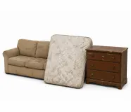 Old furniture removal items including couch, mattress, and dresser during a garage cleanout in Colorado
