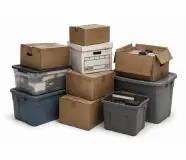 Boxes, storage bins, and clutter during a garage cleanout service in Colorado